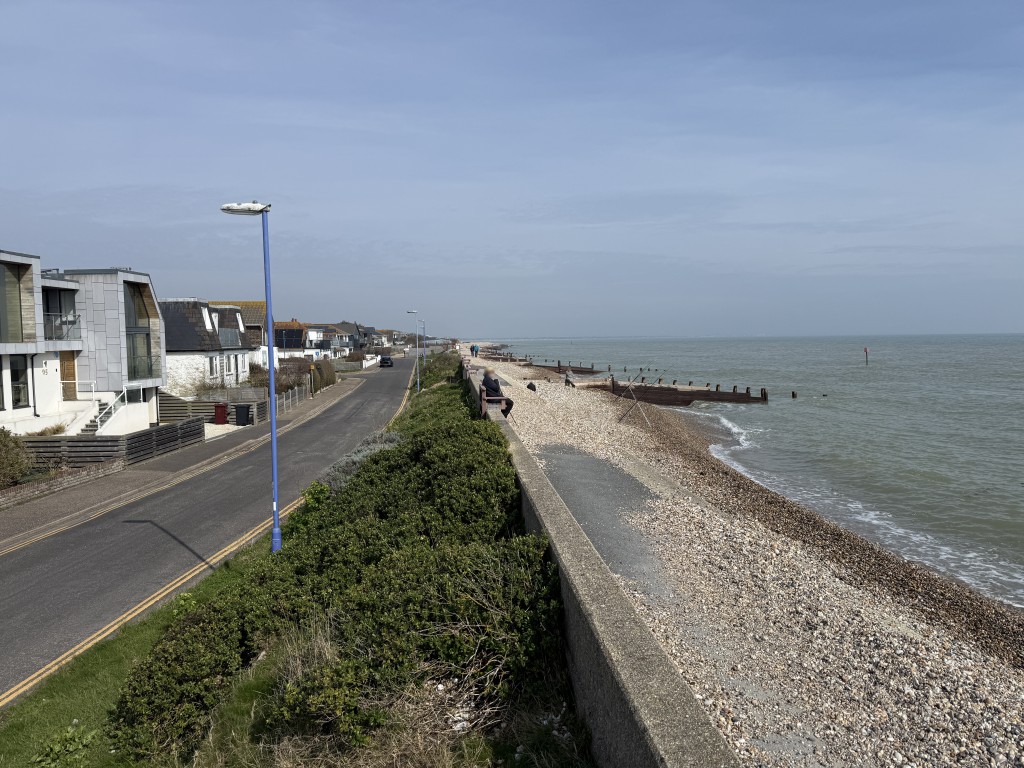 Lot: 124 - FREEHOLD LAND MADE UP OF VERGES, ROADS, PATHWAYS AND BEACH - View of East Beach Road and beach